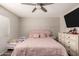 Relaxing bedroom featuring a soft pink bed and built-in dresser at 23749 W Grove St, Buckeye, AZ 85326