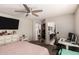 Spacious bedroom with a ceiling fan and en-suite bathroom access at 23749 W Grove St, Buckeye, AZ 85326