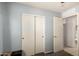 Well-lit bedroom features carpet and closet with sliding doors at 23749 W Grove St, Buckeye, AZ 85326