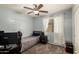 Cozy bedroom featuring a ceiling fan, neutral walls, and carpet flooring for comfort at 23749 W Grove St, Buckeye, AZ 85326
