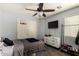 Functional bedroom with ceiling fan, TV, closet and dresser at 23749 W Grove St, Buckeye, AZ 85326