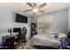 Spacious bedroom with a large window, a desk, and a comfortable bed at 23749 W Grove St, Buckeye, AZ 85326
