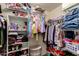 Organized walk-in closet with shelving and hanging racks for ample storage solutions at 23749 W Grove St, Buckeye, AZ 85326