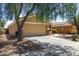 View of the home's facade, showcasing its neutral color palette and attached two-car garage at 23749 W Grove St, Buckeye, AZ 85326