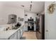 Updated kitchen boasts stainless steel appliances and sleek countertops at 23749 W Grove St, Buckeye, AZ 85326