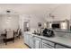 Bright and airy kitchen with a dining area and view into the living room at 23749 W Grove St, Buckeye, AZ 85326