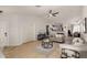 Inviting living room with tile flooring, a ceiling fan, and comfortable seating arrangement at 23749 W Grove St, Buckeye, AZ 85326