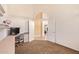 Bedroom with neutral carpet features vaulted ceilings, window and attached desk at 251 E Arabian Dr, Gilbert, AZ 85296