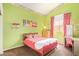 Childs bedroom featuring brightly painted walls, desk, bed, and dresser at 251 E Arabian Dr, Gilbert, AZ 85296