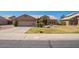 Charming single-story home with well-manicured lawn and inviting curb appeal at 251 E Arabian Dr, Gilbert, AZ 85296