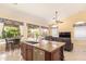 Modern kitchen with stainless appliances, granite countertops, and outside views at 251 E Arabian Dr, Gilbert, AZ 85296