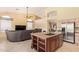Open-concept kitchen with a granite island, stainless appliances, and ample cabinet space at 251 E Arabian Dr, Gilbert, AZ 85296