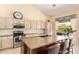 Modern kitchen with stainless steel appliances, granite countertops, and an island at 251 E Arabian Dr, Gilbert, AZ 85296