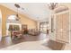 Inviting living space with high ceilings, elegant chandeliers, and tiled floors at 251 E Arabian Dr, Gilbert, AZ 85296