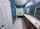 Elegant bathroom featuring double sinks, modern fixtures, and a freestanding tub at 26747 W Pontiac Dr, Buckeye, AZ 85396