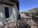 View of the side of the property with a black metal fence and desert landscaping at 26747 W Pontiac Dr, Buckeye, AZ 85396