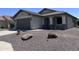 Charming single-story home with a well-maintained front yard and attached two car garage at 26747 W Pontiac Dr, Buckeye, AZ 85396