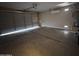 Spacious garage with ample parking space and overhead door at 26747 W Pontiac Dr, Buckeye, AZ 85396