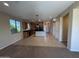 Open concept floorplan with tile and carpet flooring and natural light at 26747 W Pontiac Dr, Buckeye, AZ 85396