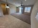 Open living space with tile and carpet flooring and lots of natural light at 26747 W Pontiac Dr, Buckeye, AZ 85396