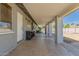 Long covered patio perfect for entertaining, features an outdoor bar and access to the backyard at 2908 N 54Th Dr, Phoenix, AZ 85031