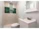 Updated bathroom features a tiled shower with niche, modern vanity, and stylish fixtures at 2908 N 54Th Dr, Phoenix, AZ 85031