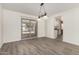 Light-filled dining room featuring sliding glass doors that lead to the backyard at 2908 N 54Th Dr, Phoenix, AZ 85031