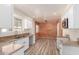 Updated kitchen features modern appliances, white cabinetry, and plenty of counter space for cooking and entertaining at 2908 N 54Th Dr, Phoenix, AZ 85031