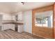 Bright kitchen features white cabinetry, stainless steel appliances, and a window offering ample natural light at 2908 N 54Th Dr, Phoenix, AZ 85031
