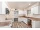 Beautiful kitchen with white cabinets, modern appliances, and a functional layout perfect for cooking at 2908 N 54Th Dr, Phoenix, AZ 85031