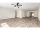 The open-concept living room is bright and airy, featuring a ceiling fan and neutral walls at 2908 N 54Th Dr, Phoenix, AZ 85031