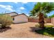 Cozy backyard featuring decorative rock and partial view of a palm tree at 3006 W Matthew Dr, Phoenix, AZ 85027