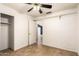 Bright bedroom features an open closet space, ceiling fan and tile flooring at 3006 W Matthew Dr, Phoenix, AZ 85027