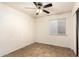 This room features tile flooring, a ceiling fan, a window, and closet with sliding doors at 3006 W Matthew Dr, Phoenix, AZ 85027