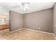 Neutral-toned bedroom with tile floors and ensuite bathroom at 3006 W Matthew Dr, Phoenix, AZ 85027