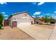 Charming single-story home featuring a spacious driveway and attached two-car garage at 3006 W Matthew Dr, Phoenix, AZ 85027