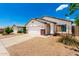 Single-story house with a two-car garage, desert landscaping, and a well-maintained front yard at 3006 W Matthew Dr, Phoenix, AZ 85027