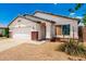 Single-story home featuring a two-car garage, desert landscaping, and covered entryway at 3006 W Matthew Dr, Phoenix, AZ 85027