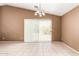 Bright living room featuring tiled floors and sliding glass doors for optimal natural lighting at 3006 W Matthew Dr, Phoenix, AZ 85027