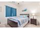 Bedroom with a ceiling fan, carpeted flooring, and a bed with two end tables at 3025 N Desert Horizons Ln, Casa Grande, AZ 85122