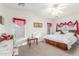 Bright and airy bedroom with ample natural light, ceiling fan, and comfortable layout at 3025 N Desert Horizons Ln, Casa Grande, AZ 85122