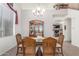 Cozy dining room with a large hutch and window light offering a cozy feel to the space at 3025 N Desert Horizons Ln, Casa Grande, AZ 85122