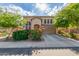 Charming two-story home with desert landscaping, a tile roof, and an attached two-car garage at 3025 N Desert Horizons Ln, Casa Grande, AZ 85122