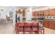 Stylish kitchen with island seating, granite countertops, and stainless steel appliances at 3025 N Desert Horizons Ln, Casa Grande, AZ 85122