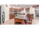 Spacious kitchen with a large island, stainless appliances and adjacent dining area at 3025 N Desert Horizons Ln, Casa Grande, AZ 85122