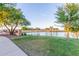 Community pond view of the calm water and surrounding greenery offering a peaceful retreat at 3025 N Desert Horizons Ln, Casa Grande, AZ 85122