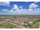 Expansive view of a densely populated neighborhood featuring well-kept homes, green spaces, and community parks at 3586 S Moccasin Trl, Gilbert, AZ 85297