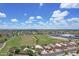 Scenic neighborhood shot showcases green spaces, sports fields, and well-spaced homes under a bright sky at 3586 S Moccasin Trl, Gilbert, AZ 85297