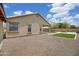 Gravel backyard with artificial turf grass and view of the covered patio at 3586 S Moccasin Trl, Gilbert, AZ 85297