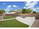 Backyard featuring lush grass, a seating area, and a fire pit at 3586 S Moccasin Trl, Gilbert, AZ 85297